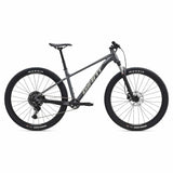 Giant Talon 29 1 mountain bike with Shimano CUES U6000 disc brakes, unisex MTB bike, black and red frame, rugged tires.