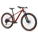 Liv Tempt 2 mountain bike with ALUXX aluminum frame, 27.5/29-inch wheels, and 1x drivetrain, shown in a riding position.
