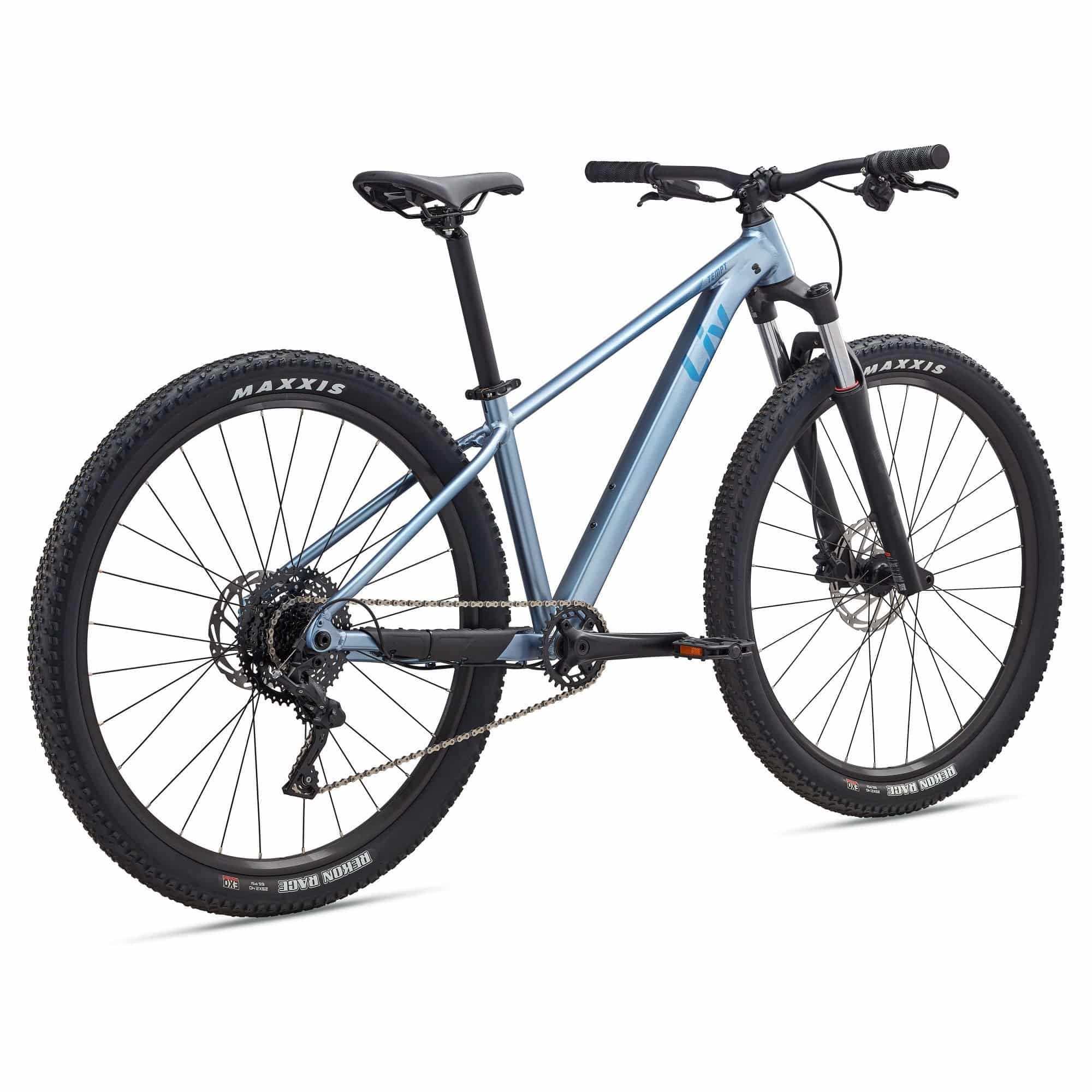 Liv Tempt 29 2 women's mountain bike with 29-inch wheels and 1x drivetrain, shown in a riding position with mountain trail background.