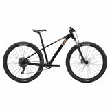 Liv Tempt 4 trail mountain bike with ALUXX aluminum frame and 27.5" or 29" wheels, shown outdoors on a dirt trail.