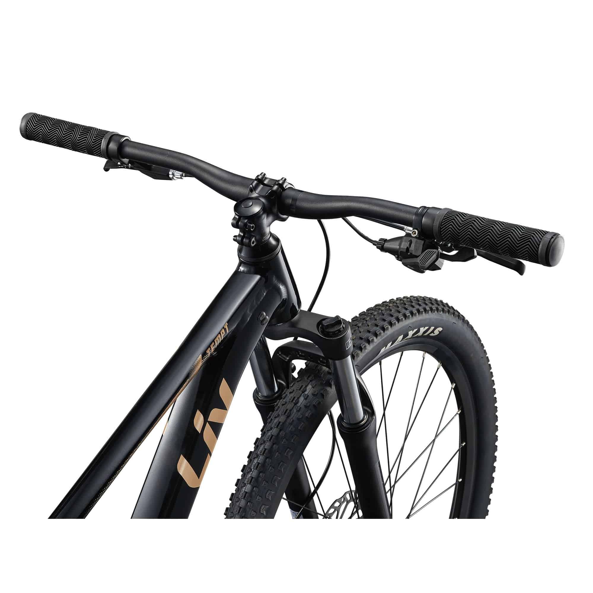 Liv Tempt 4 Trail mountain bike with aluminum frame and 27.5 or 29-inch wheels, shown on rugged trail terrain.