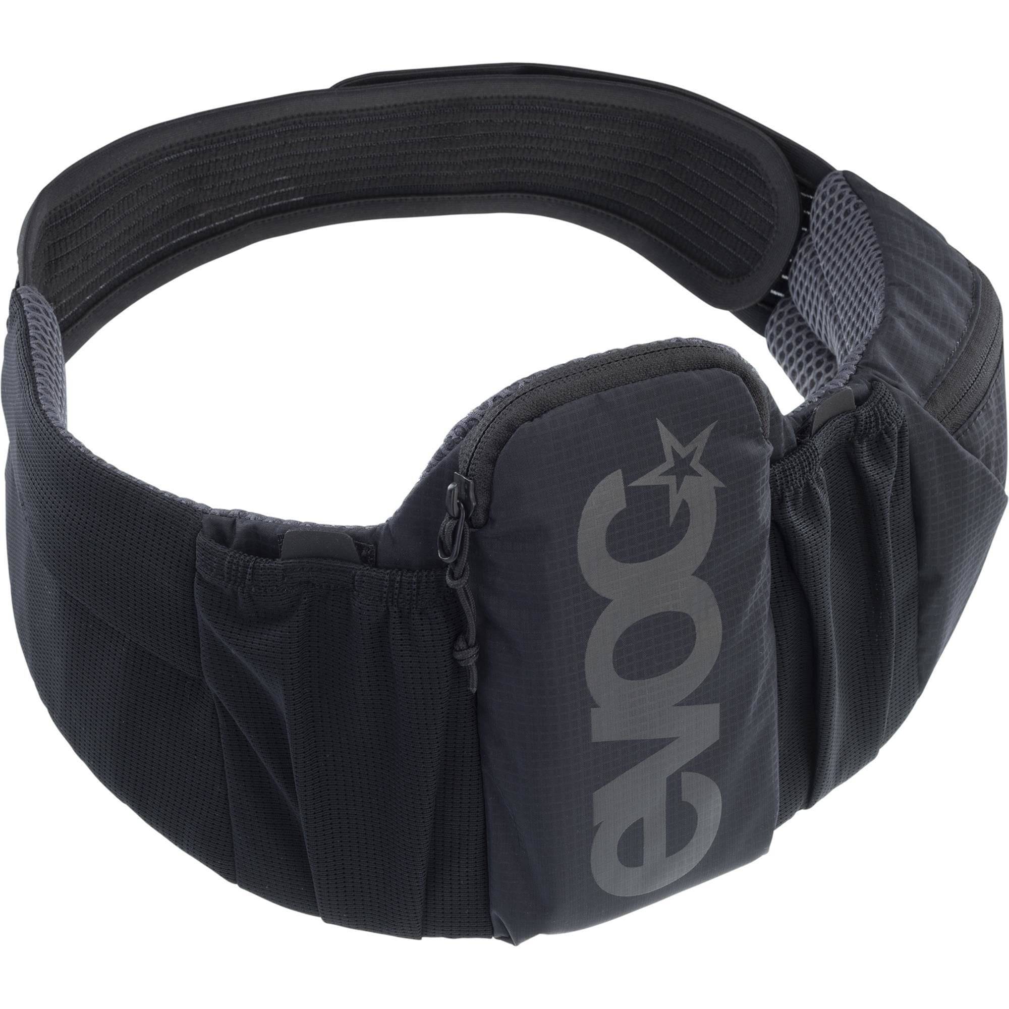 EVOC Trail Belt 08L adjustable outdoor pannier bag with multiple compartments for essentials, shown in a natural outdoor setting.