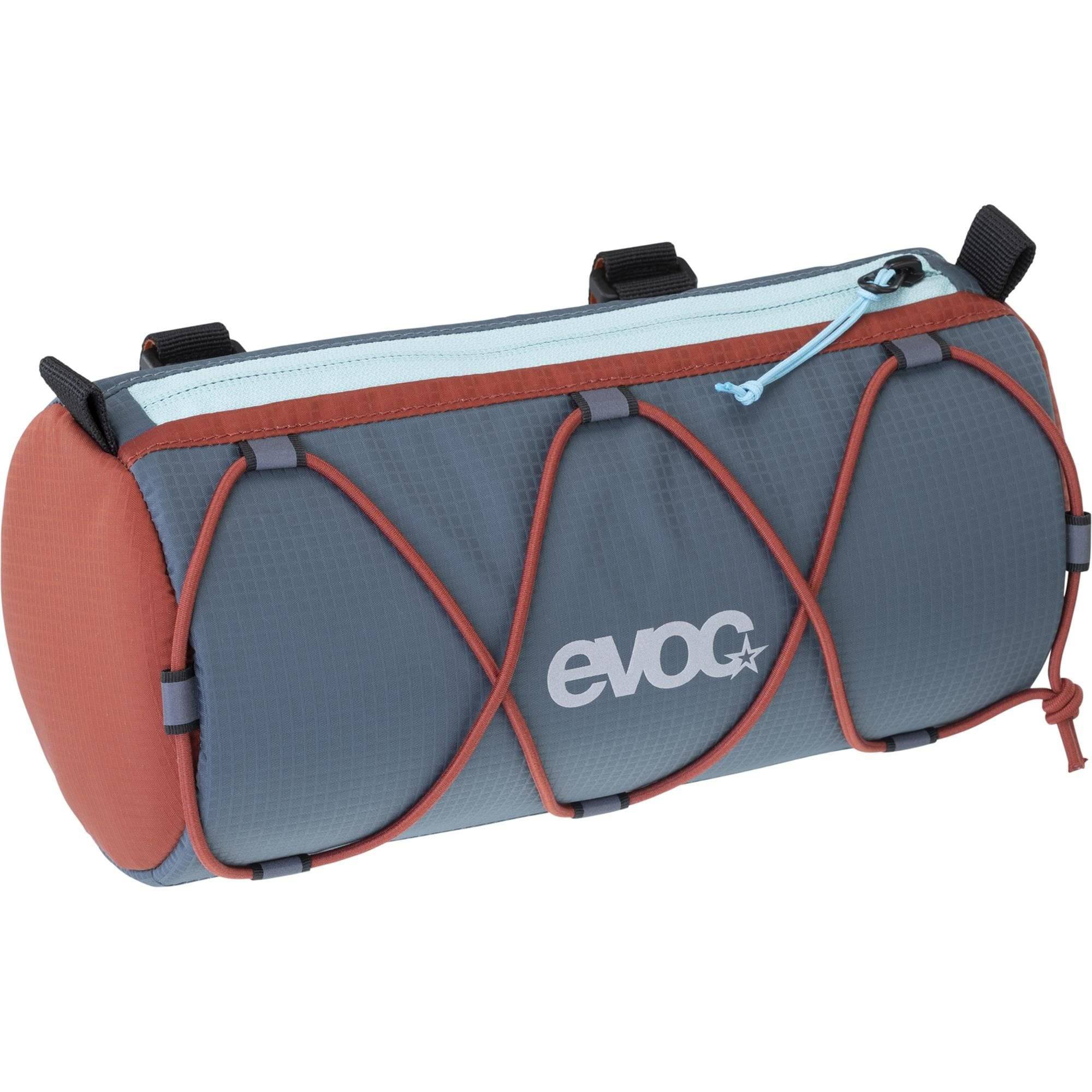 EVOC Handlebar Roll Upcycle Bag attached to a bike handlebar, showcasing eco-friendly bike accessory in a vibrant, random color.