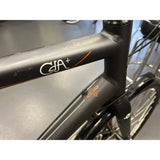 Genesis CDA 20 men's road bike with 700c wheels, lightweight frame, and performance design, ideal for road cycling enthusiasts.