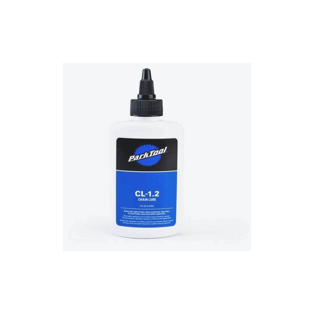 Park Tool CL-1.2 synthetic blend chain lube bottle for eco-friendly bike lubrication, shown in workshop setting