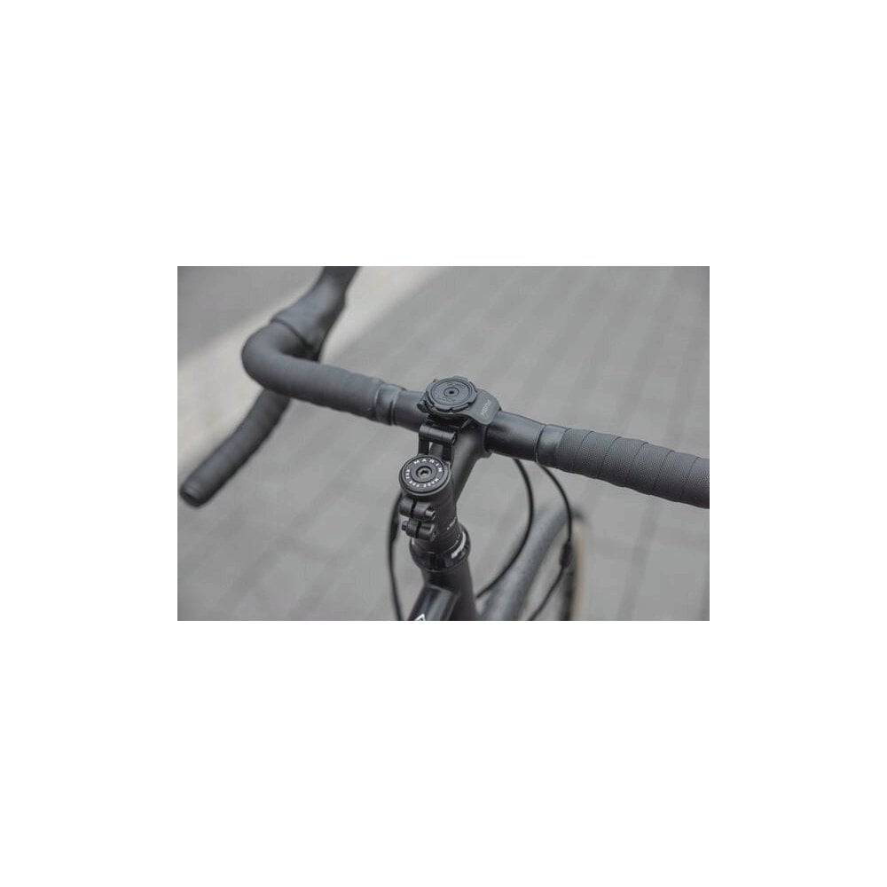 Quad Lock adjustable stem cap mount for secure smartphone bike mounting, showing the durable black accessory attached to a bike stem.