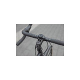 Quad Lock adjustable stem cap mount for secure smartphone bike mounting, showing the durable black accessory attached to a bike stem.