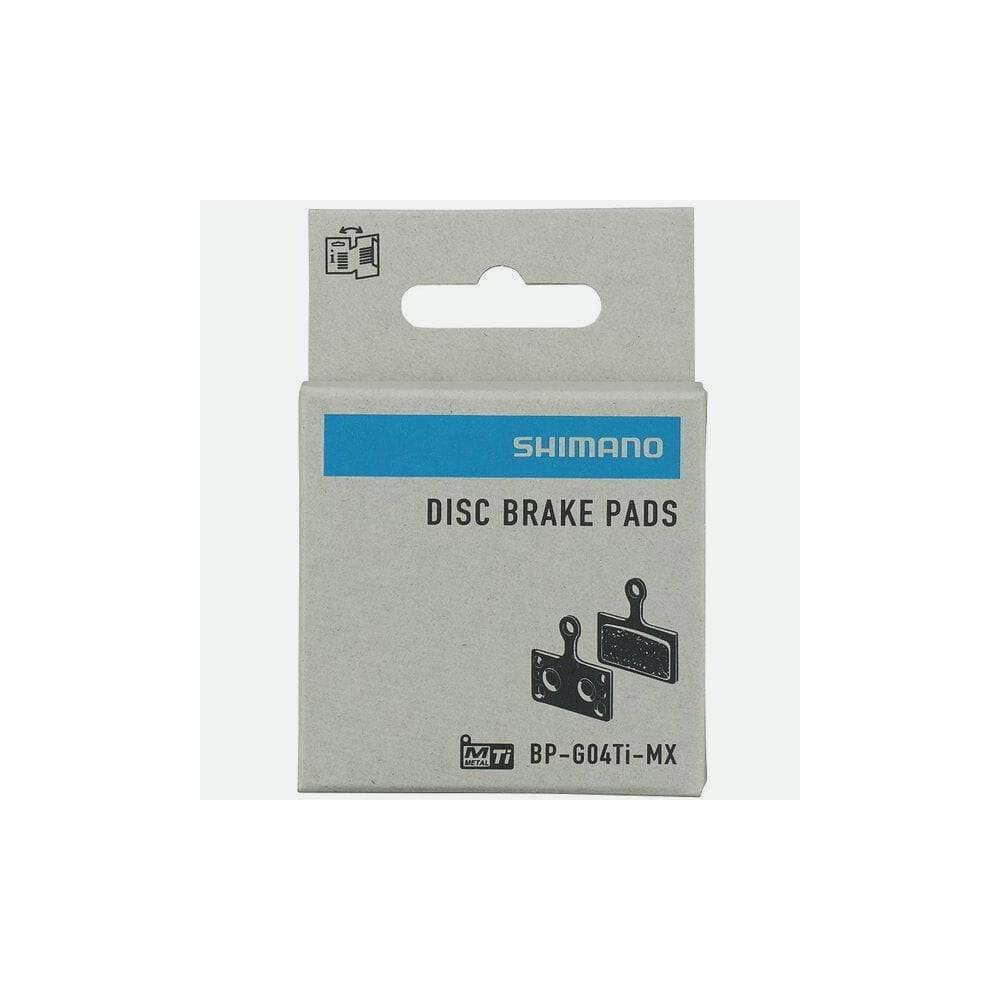 Shimano G04Ti-MX metal sintered disc brake pads with titanium back and spring, component for bicycle braking systems.
