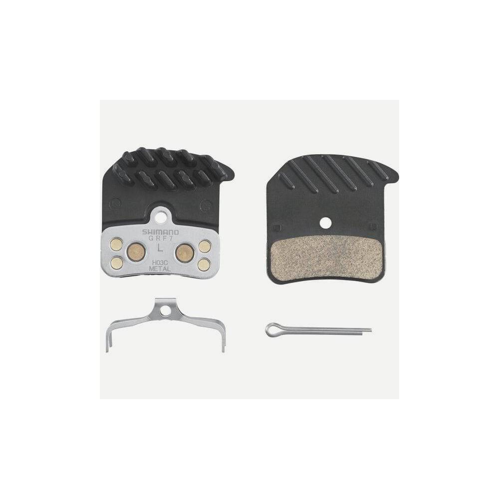 Shimano H03C-MF metal sintered disc brake pads with spring and cooling fins for 4-piston mountain bike brake calipers.