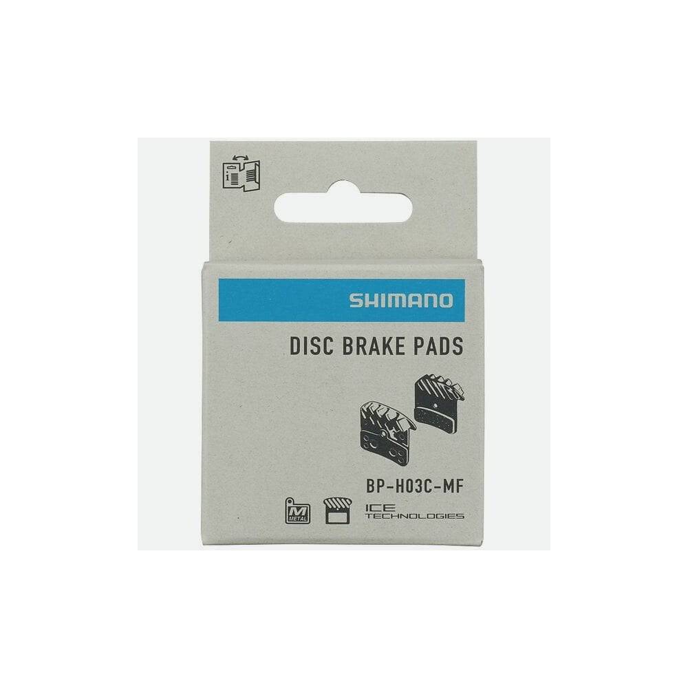 Shimano H03C-MF metal sintered disc brake pads with spring and cooling fins for 4-piston mountain bike brake systems.