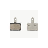 Shimano M05-RX resin disc brake pads with steel back plate for 2-piston bike brake systems, shown in close-up.