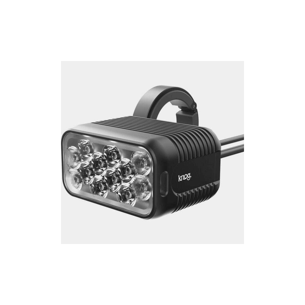 Knog Blinder X 1800 front bike light with 10,000mAh battery pack and remote, mounted on a bicycle handlebar.