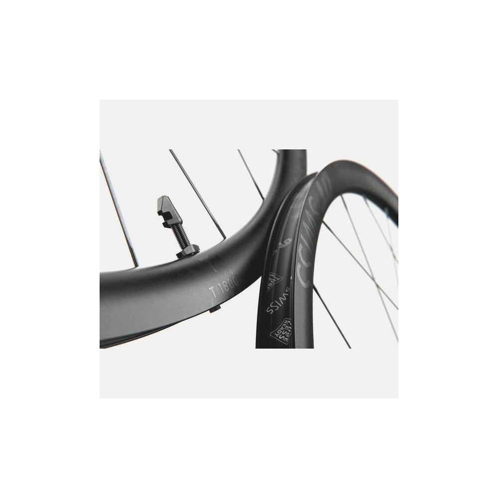 DT Swiss T 1800 front track wheel with 30mm aero alloy clincher rim, tubeless-ready, featuring a sleek black design.