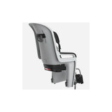 Thule RideAlong 2 rear child bike seat mounted on a bike, adjustable for kids 9 months to 6 years, with safety harness and seat padding.