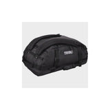 Thule Chasm duffel bag with convertible backpack straps and durable wheels, showing its rugged design and spacious storage.