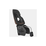 Thule Yepp Nexxt 2 Maxi frame mount child seat with suspension and safety buckle, designed for bike accessories.