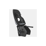 Thule Yepp Nexxt 2 Maxi rack mount child bike seat with safety harness for kids, shown installed on a bike.