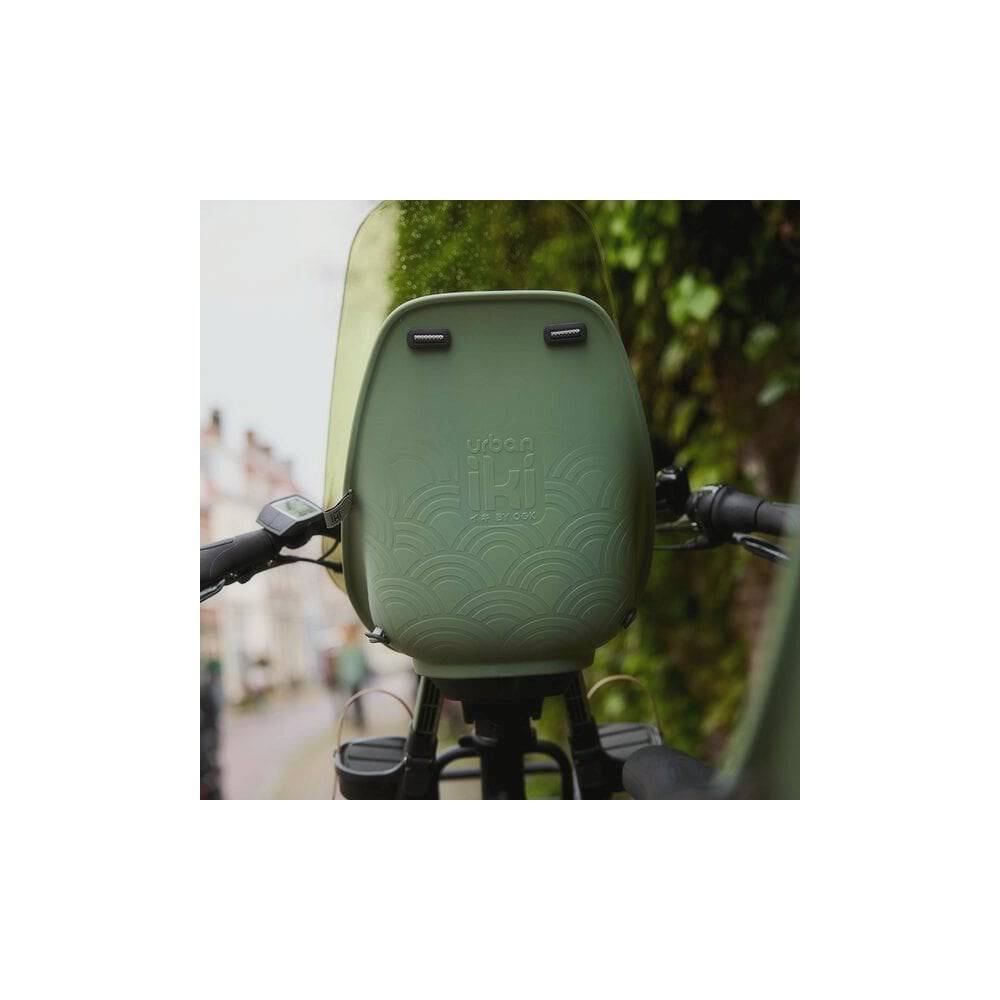 Urban Iki TA-KE front child bike seat with weather-resistant design and secure safety features for comfortable riding with children.