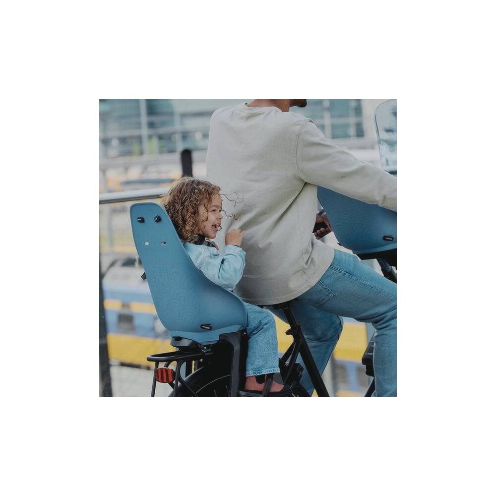 Urban Iki TA-KE rear child seat with frame mount installed on an e-bike, showing the comfortable seat and secure attachment.