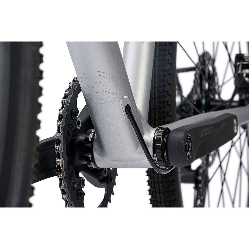 Cinelli Zydeco Silver Bootleg gravel bike with front rack, designed for urban commuting and mixed terrain riding.