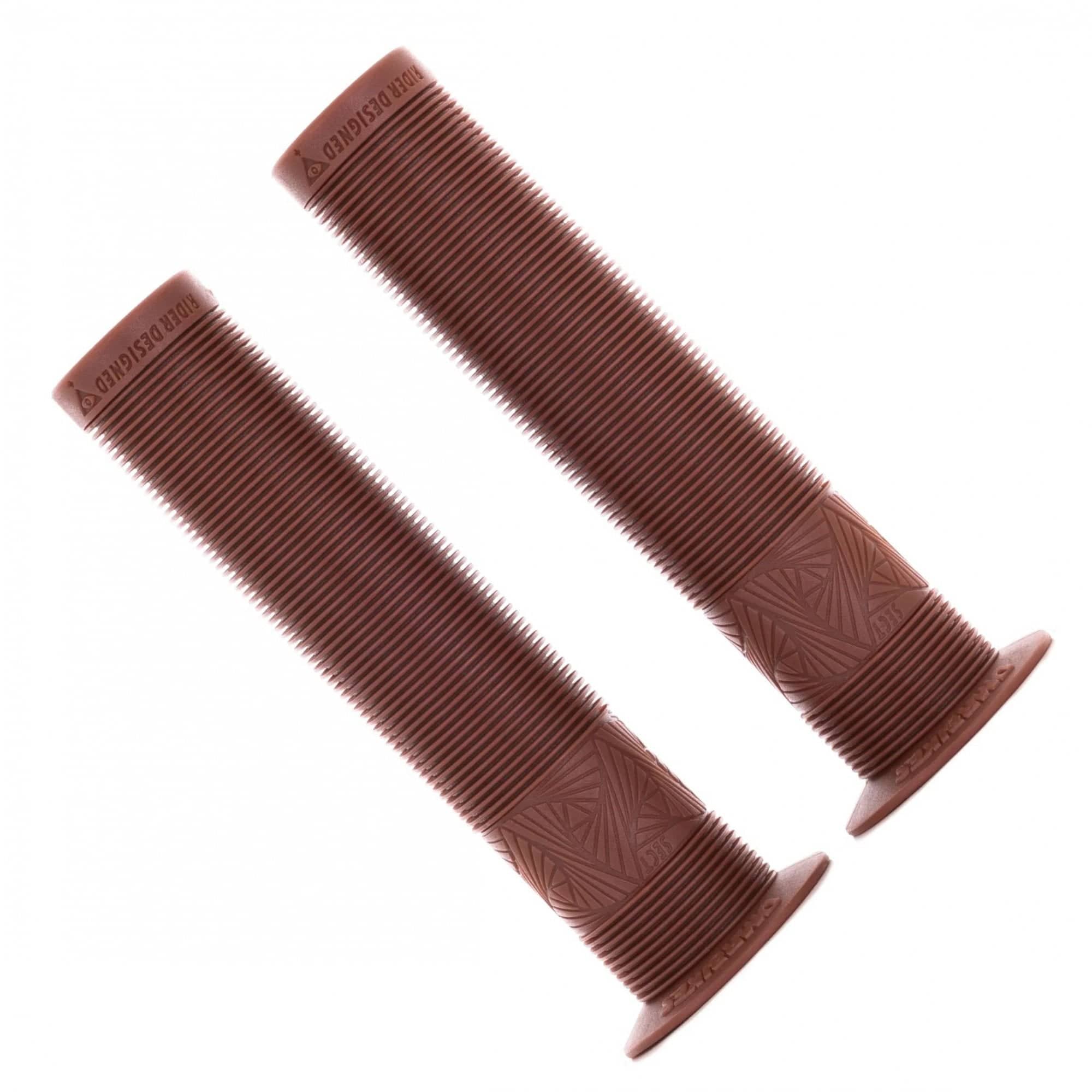 DMR Sect bike grips with durable thumb patch, designed for street, park, and dirt jump riding, shown on a mountain bike handlebar.