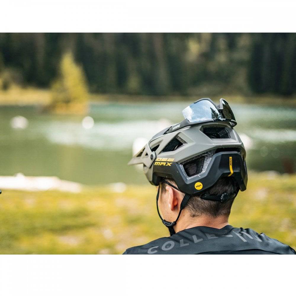 Mavic Deemax MIPS mountain bike helmet with enhanced protection and ventilation, shown in a natural outdoor setting.