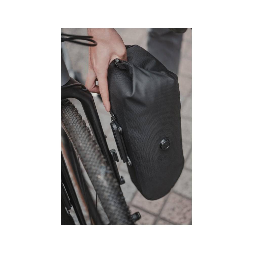 Black Topeak QR Fork Drybag 5.8L waterproof bikepacking bag attached to a bike fork with bolt-on mounting system.