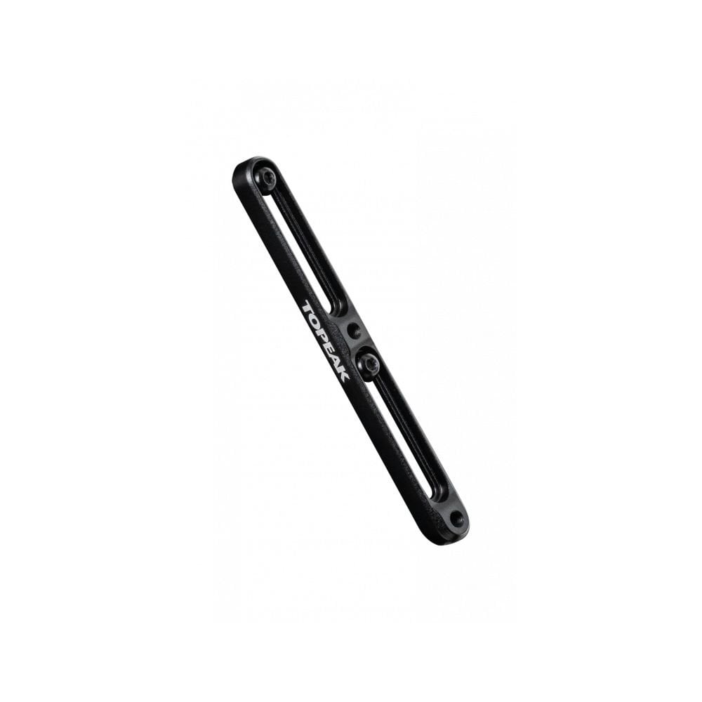 Topeak black CNC aluminum bottle cage extender, adjustable spacer for bike accessories, shown mounted on a bicycle frame.