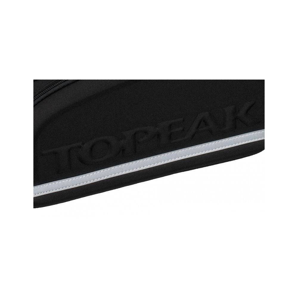 Topeak MTX TrunkBag DXP black expandable bike rack bag with pannier 2.0 mounted on a bike rack.