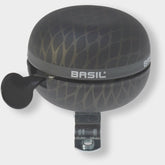 Basil Noir bicycle bell with black metallic finish and snakeskin pattern, 60mm, for bike safety and stylish cycling accessories.