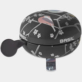 Basil Wanderlust Big Bicycle Bell 80mm in charcoal with bird print, bike safety accessory for cycling visibility and sound.