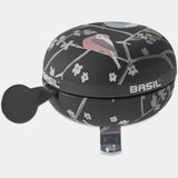 Basil Wanderlust Big Bicycle Bell 80mm in charcoal with bird print, bike safety accessory for cycling visibility and sound.