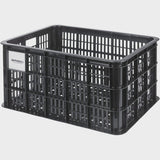 Large Basil Basil Bicycle Crate MIK 40L black recycled synthetic bike basket attached to a bicycle for carrying goods.