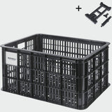 Large Basil Basil Bicycle Crate MIK 40L black recycled synthetic bike basket attached to a bicycle for carrying items.