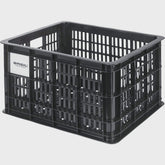 Black Basil Bicycle Crate MIK Medium 29.5L recycled synthetic bike basket attached to a bicycle for carrying gear.