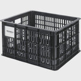 Black Basil Bicycle Crate MIK Medium 29.5L recycled synthetic bike basket attached to a bicycle for carrying belongings.