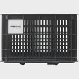 Black Basil Bicycle Crate MIK Medium 29.5L recycled synthetic bike basket attached to a bicycle for carrying items.