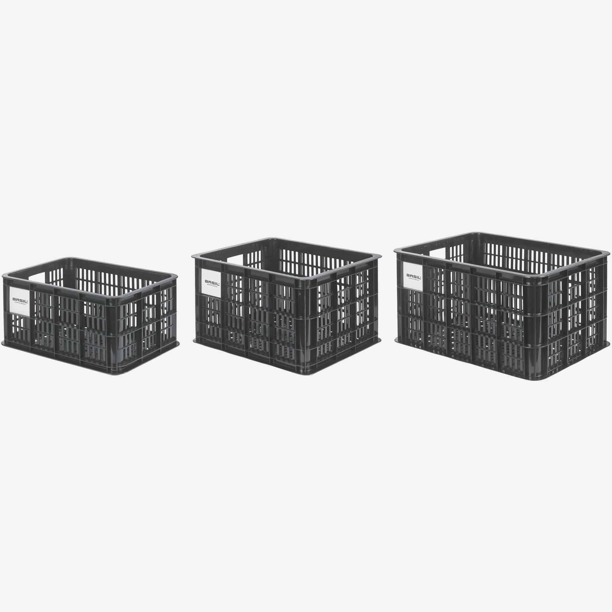 Black Basil Bicycle Crate MIK Medium 29.5L recycled synthetic bike basket attached to a bicycle for carrying goods.