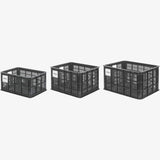 Black Basil Bicycle Crate MIK Medium 29.5L recycled synthetic bike basket attached to a bicycle for carrying goods.