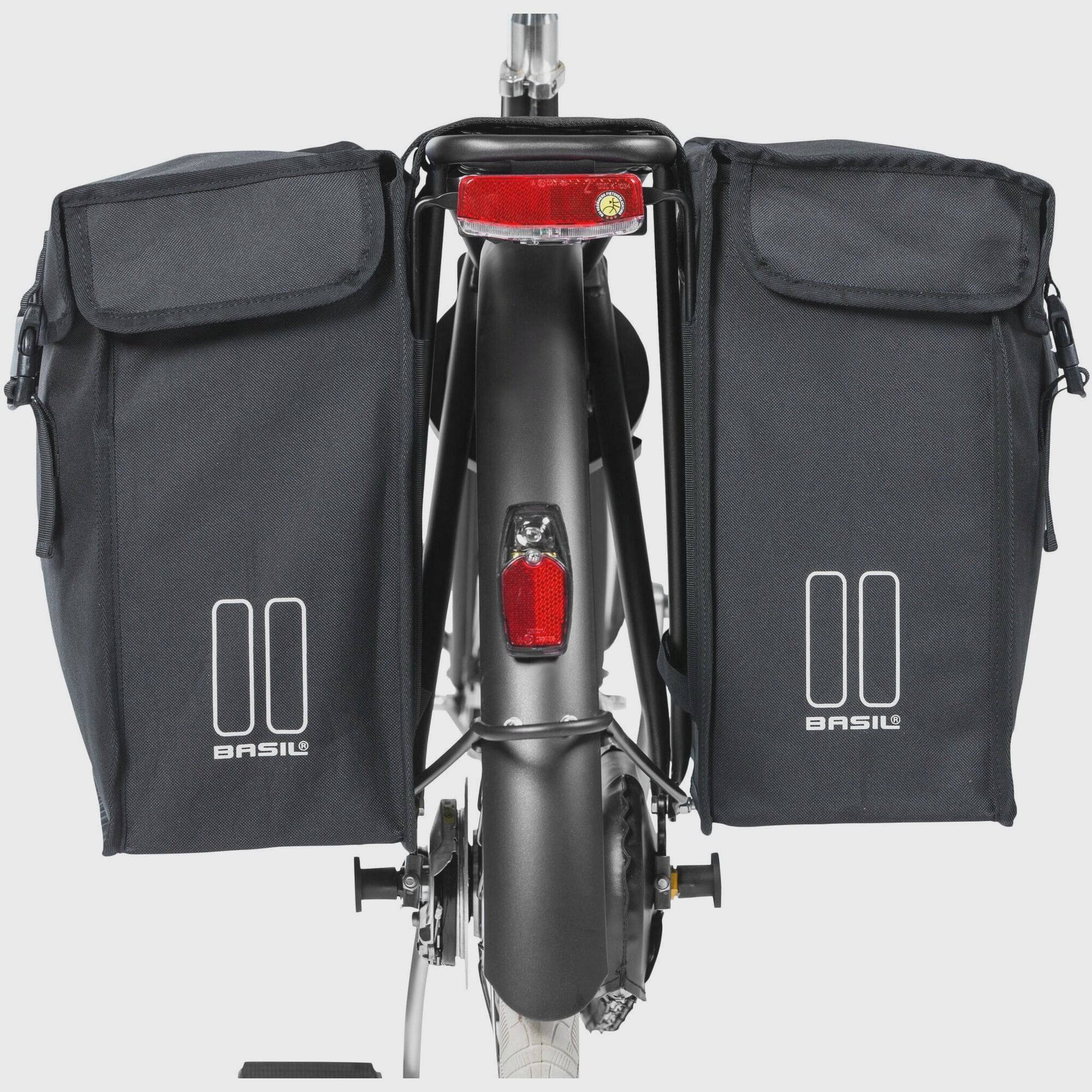 Black Basil distance holder for double panniers with rear light mount, accessory for bike racks and luggage.