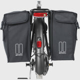 Black Basil distance holder for double panniers with rear light mount, accessory for bike racks and luggage.