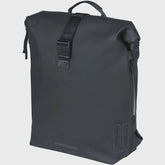 Basil SoHo Nordlicht 17L bicycle backpack in night black with integrated LED light, showing adjustable straps and reflective details.