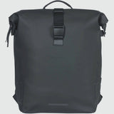 Basil SoHo Nordlicht 17L bicycle backpack in Night Black with integrated LED light, showing adjustable straps and reflective details.