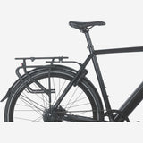 Basil Universal Cargo Carrier MIK STUDS in matte black attached to a 26-29 inch bike for carrying gear.