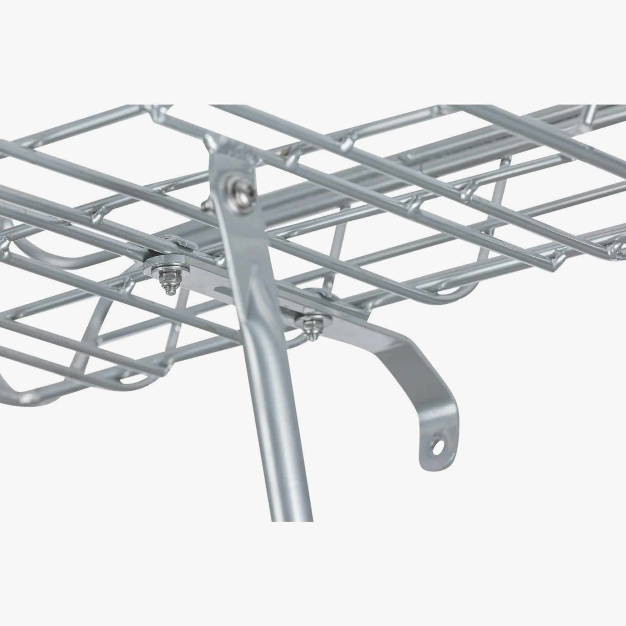 Basil Portland aluminium front bike carrier with lamp mount for 26 and 28-inch bikes, shown with mounted accessories.
