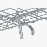Basil Portland aluminium front bike carrier with lamp mount for 26 and 28-inch bikes, shown with mounted accessories.