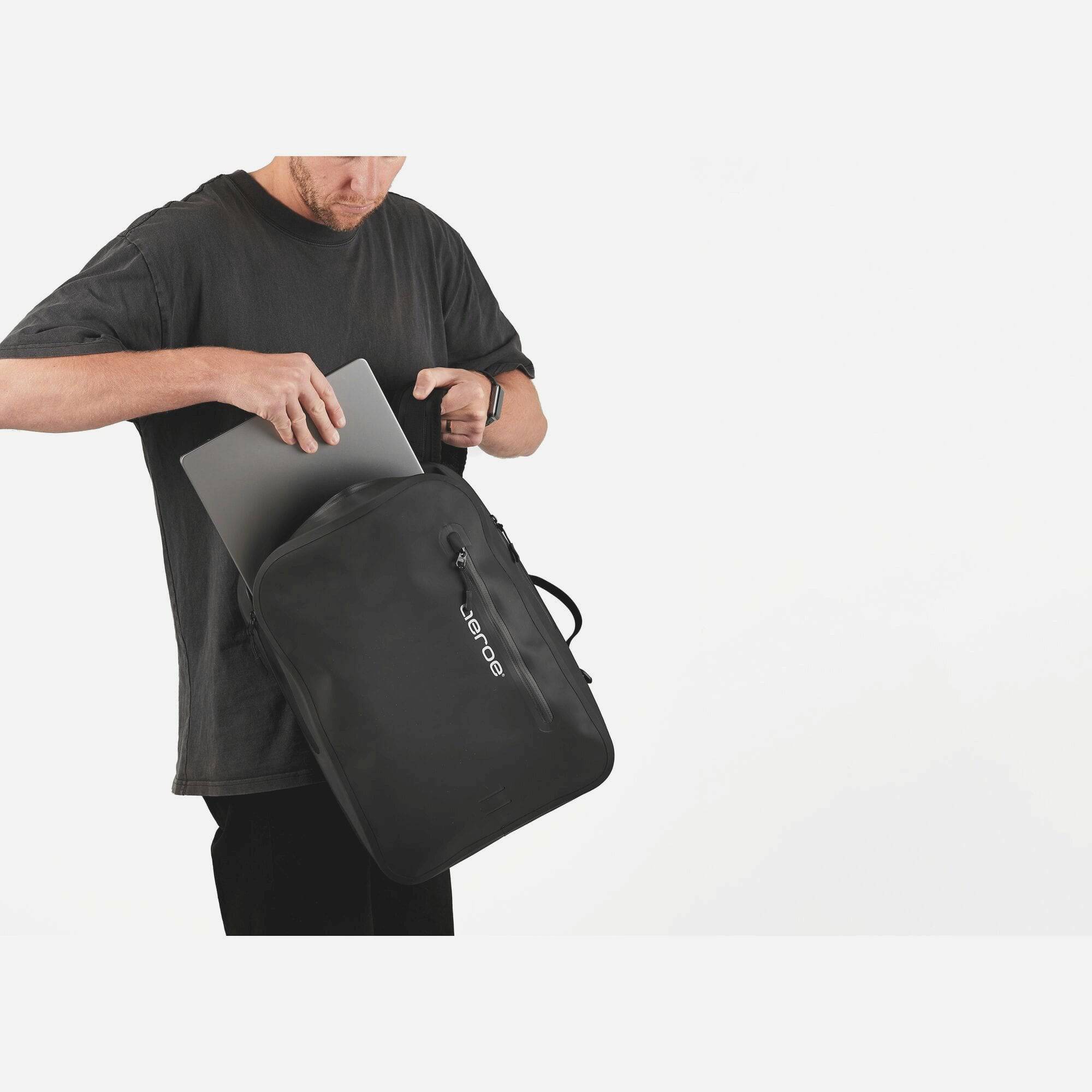 Aeroe QuickLock Urban Backpack 10L waterproof bike bag with versatile carry options, shown with straps and secure attachment system.