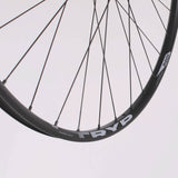 M Part Wheels M25 v2 29-inch boost front MTB wheel with tubeless-ready hub and 110x15mm boost axle, mounted on a mountain bike.