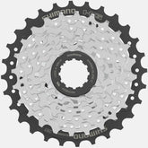 Shimano Altus 7-speed cassette with Hyperglide sprockets, 11-28T gear range, for bike components and drivetrain upgrades.