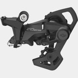 Shimano CUES RD-U4010 rear derailleur for 9/10-speed bikes, with shadow design, E-bike rated, mounted on a bike drivetrain.